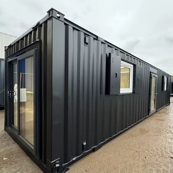 Contenedor oficina 9,7x3m con puerta corrediza - vista exterior | Sit Partners
