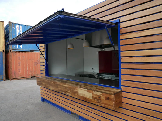 Café en contenedor marítimo con fachada de madera - vista exterior | Sit Partners